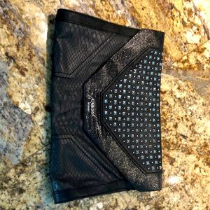 Envelope style purse. Faux leather.